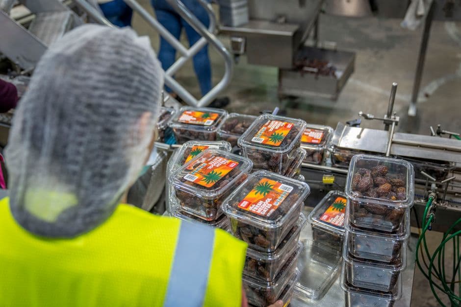 Worker handling printed polyethylene packaging